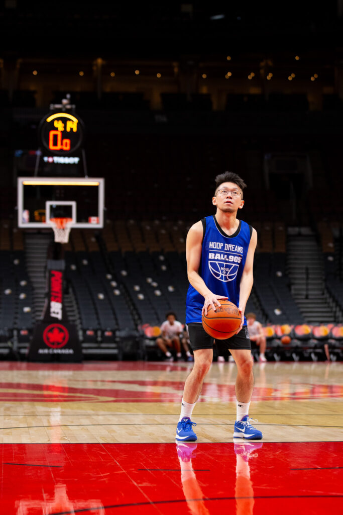 Basketball player in front of basketball net